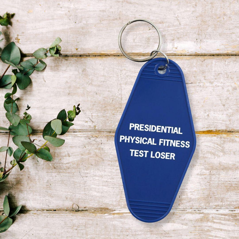 
                  
                    Presidential Physical Fitness Test Loser Motel Style Keychain in Blue | Amazing Pinatas 
                  
                