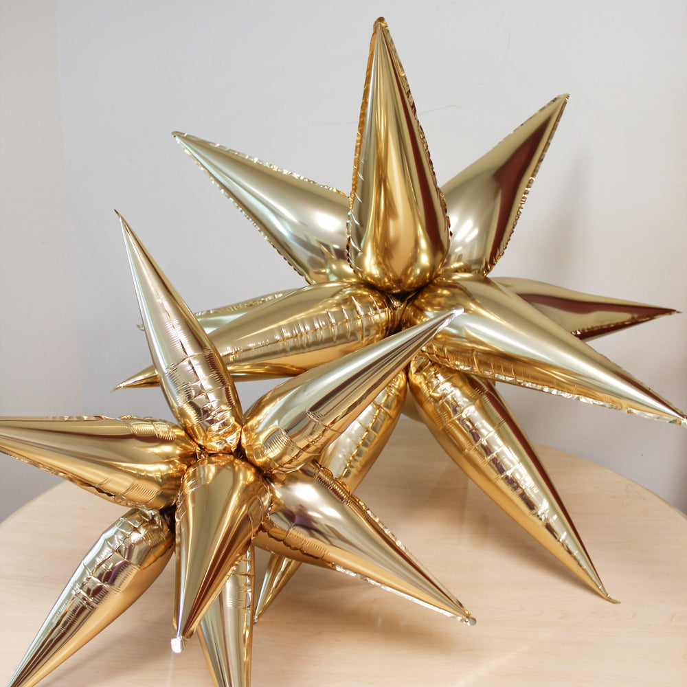 
                  
                    Ellie's Chrome Gold Starburst Cluster Balloon (40 Inches) | Amazing Pinatas 
                  
                