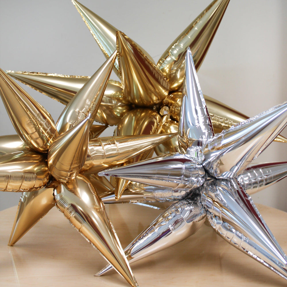 
                  
                    Ellie's Chrome Gold Starburst Cluster Balloon (40 Inches) | Amazing Pinatas 
                  
                